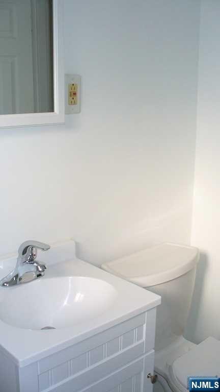 501 Linwood Drive, Unit 5J Fort Lee, NJ 07024 - Photo 14 of 23 a bathroom with a sink and a vanity