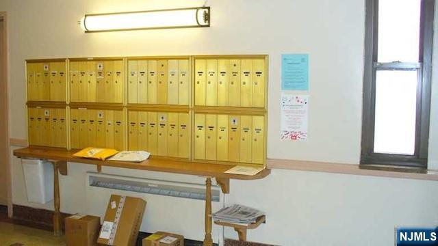 501 Linwood Drive, Unit 5J Fort Lee, NJ 07024 - Photo 19 of 23 a bathroom with a sink mirror and a bathtub