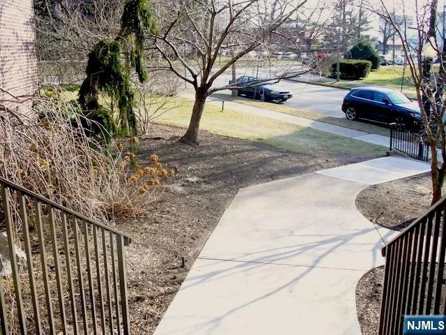 a view of street with parked cars
