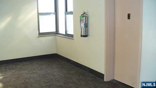 501 Linwood Drive, Unit 5J Fort Lee, NJ 07024 - Photo 4 of 23 an empty room with windows