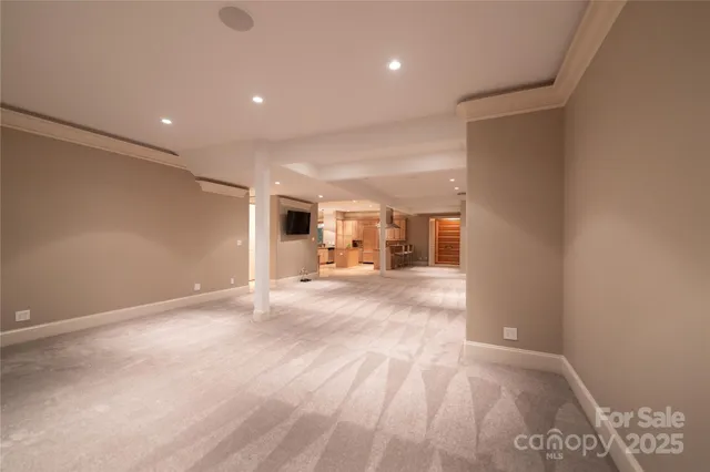 a view of a hallway with wooden shelves