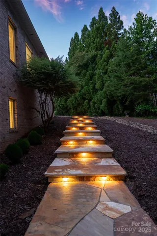 a view of a kitchen with a sink and cabinets