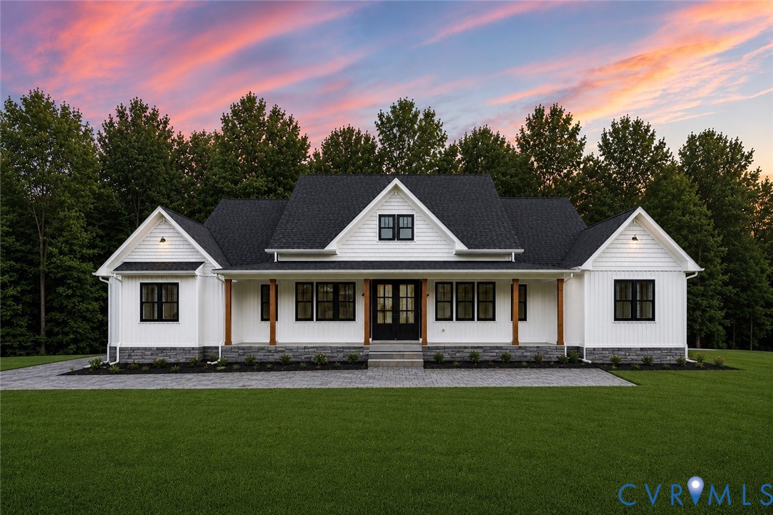 Modern farmhouse exterior featuring white board an