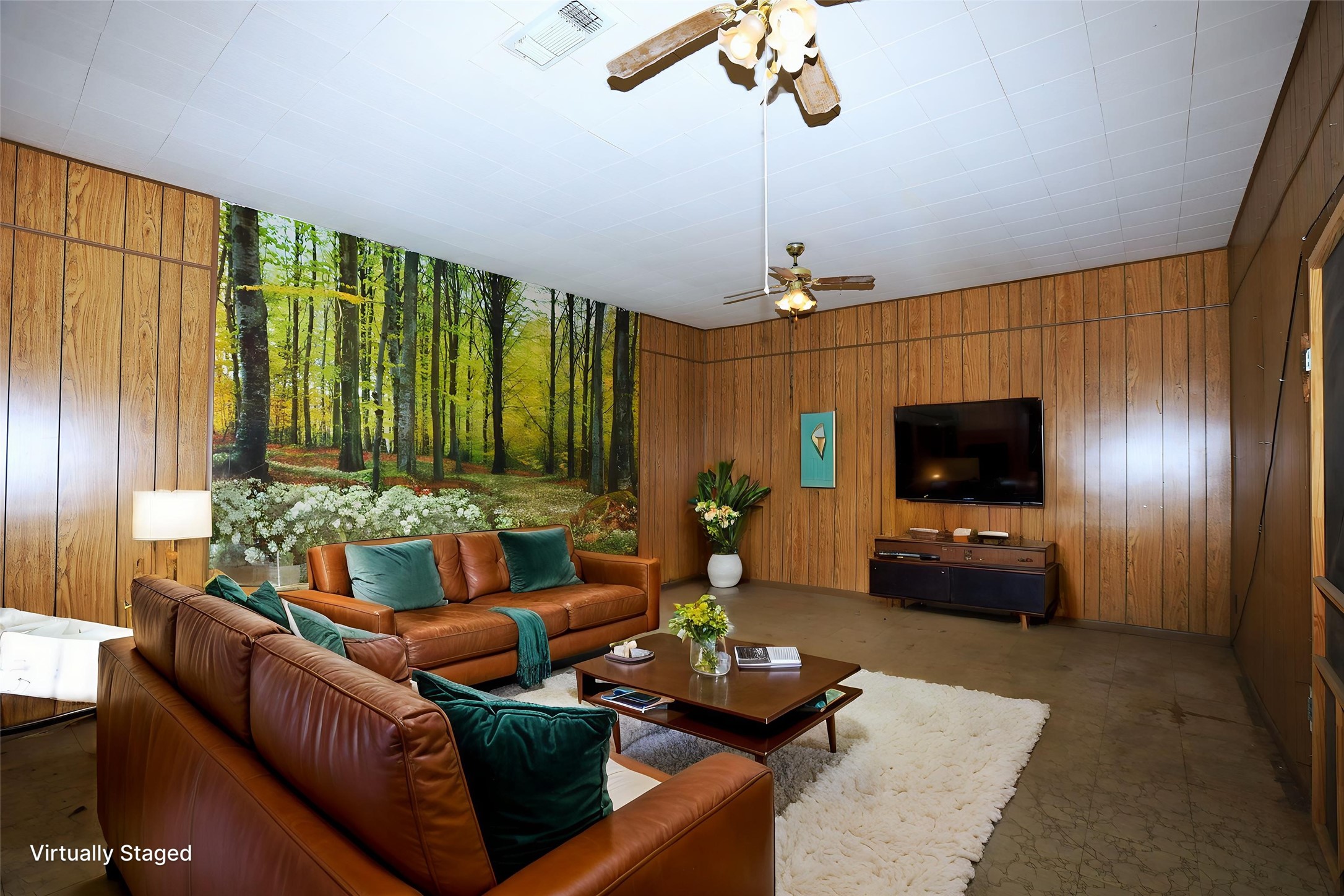 700 Wesley Drive Clute, TX 77531 - Photo 11 of 27 a living room with furniture and a flat screen tv