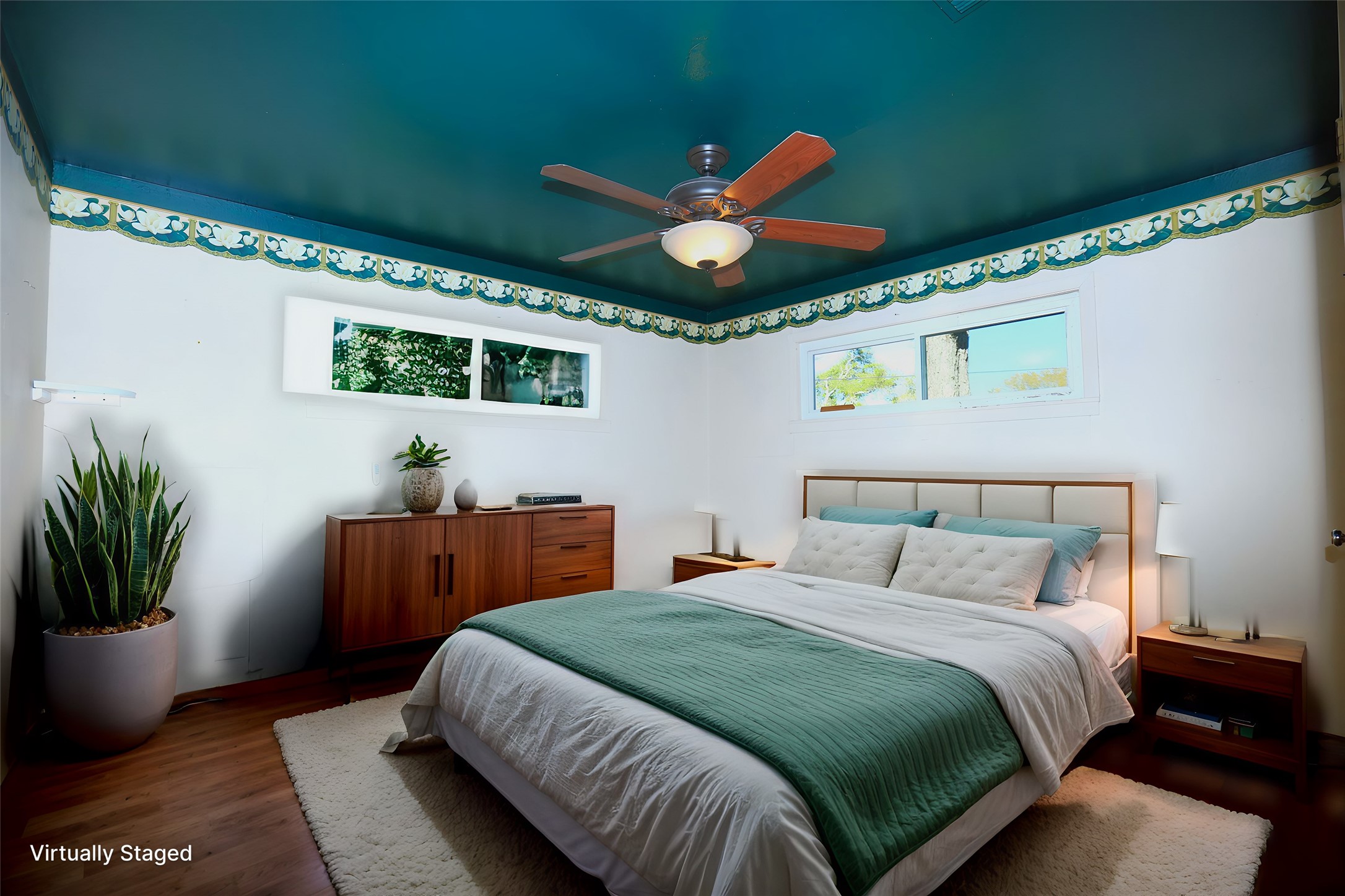 700 Wesley Drive Clute, TX 77531 - Photo 16 of 27 a bedroom with a bed and a potted plant