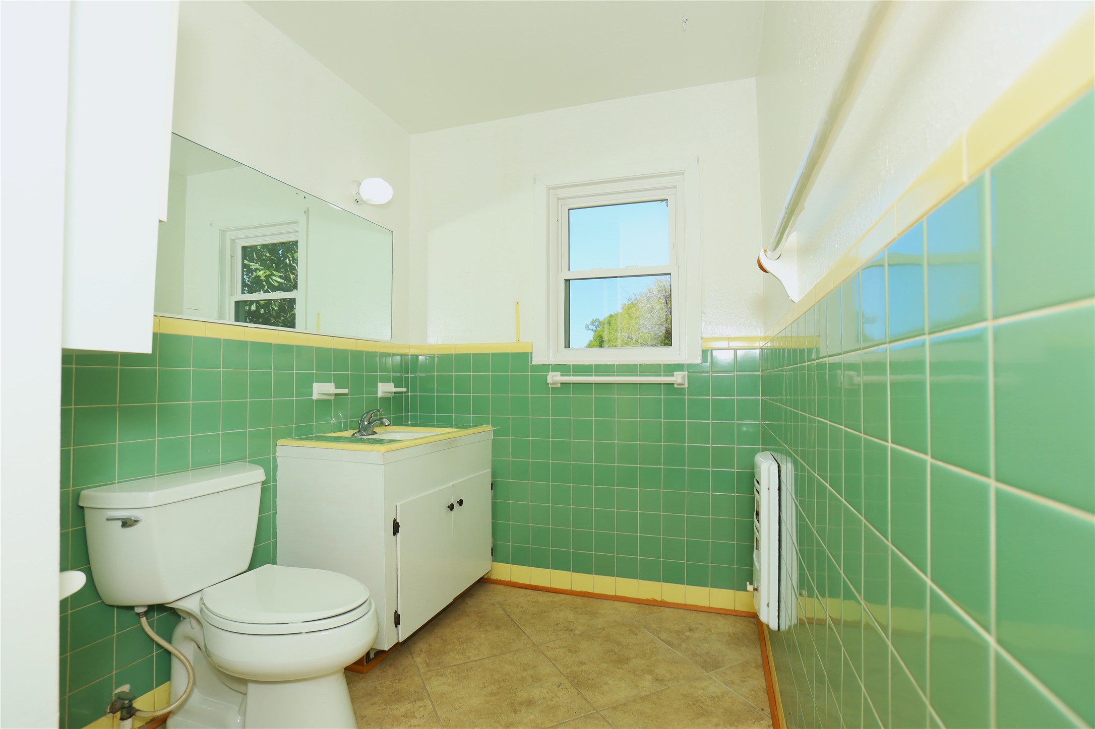 700 Wesley Drive Clute, TX 77531 - Photo 18 of 27 a bathroom with a toilet sink and mirror