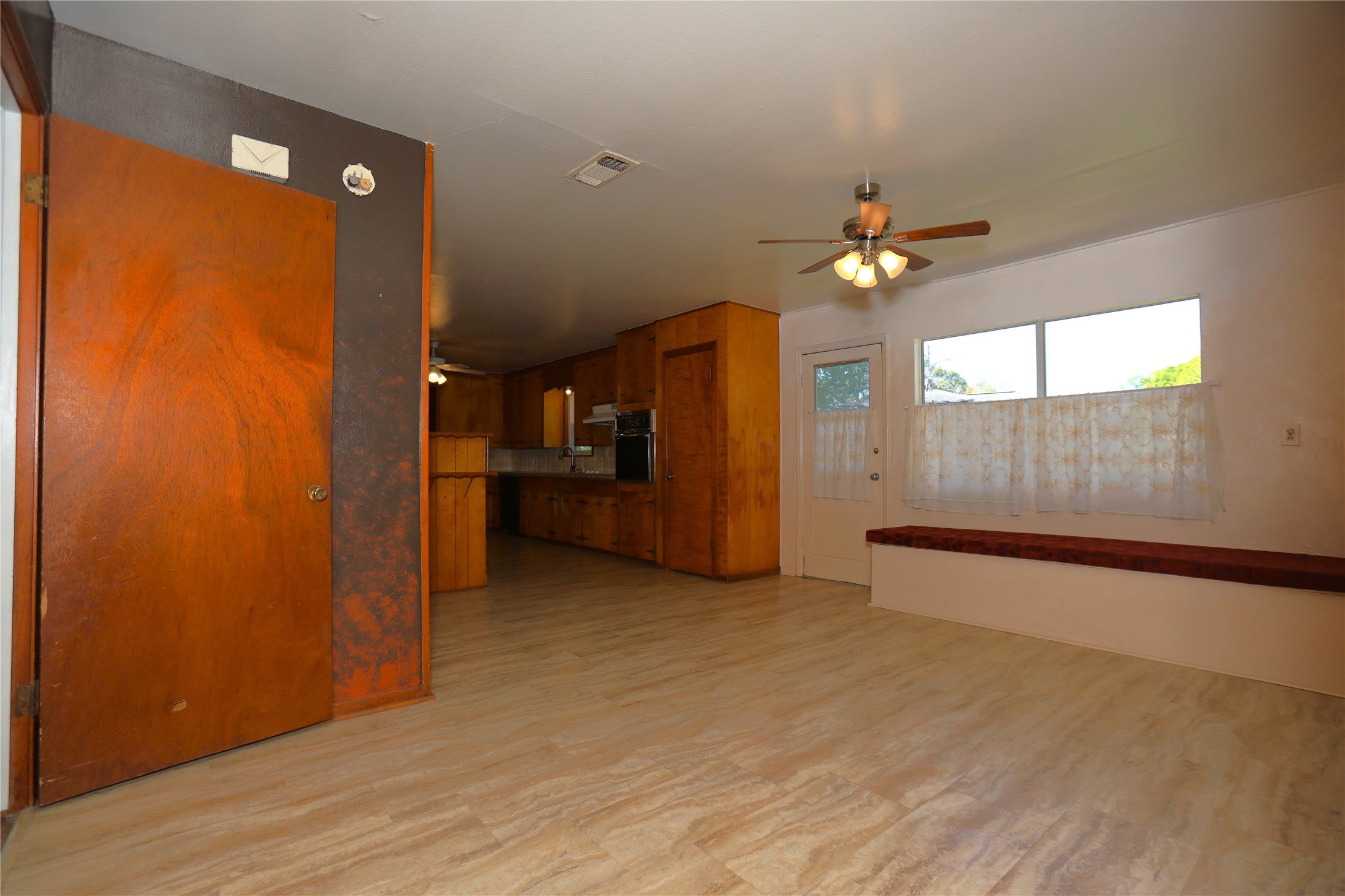 700 Wesley Drive Clute, TX 77531 - Photo 6 of 27 wooden floor in an empty room with a window
