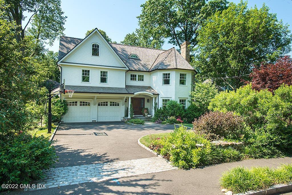 26 Hendrie Avenue Riverside, CT 06878 - Photo 1 of 37 a front view of a house with a yard
