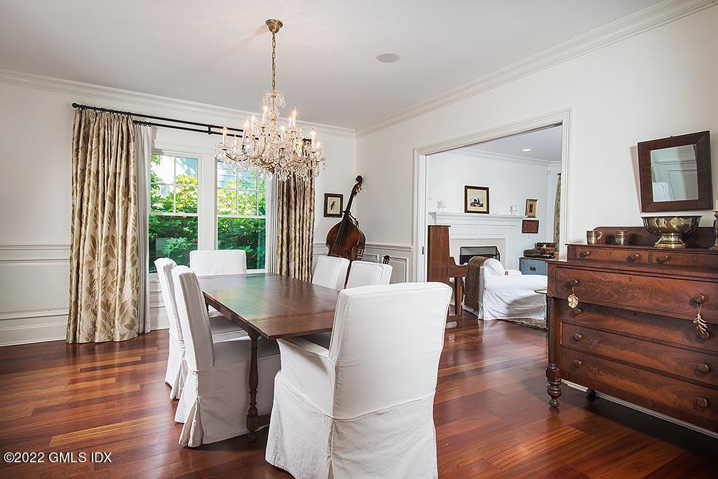 26 Hendrie Avenue Riverside, CT 06878 - Photo 11 of 37 a dining room with furniture a chandelier and wooden floor