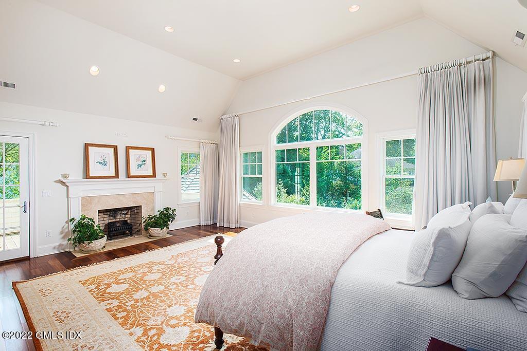 26 Hendrie Avenue Riverside, CT 06878 - Photo 12 of 37 a bed sitting in a spacious bedroom next to a window