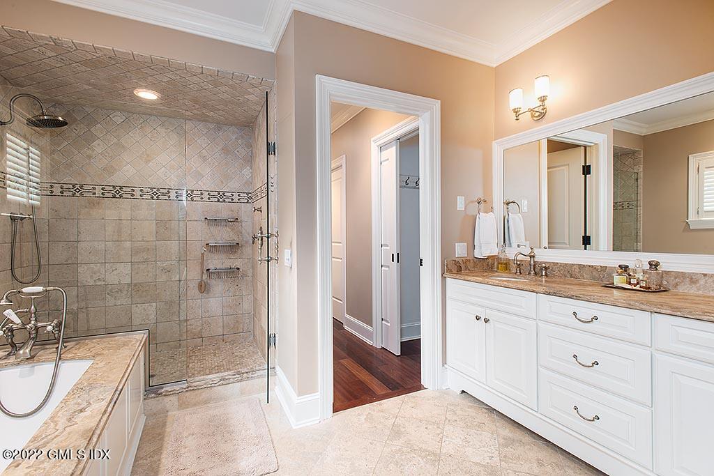 26 Hendrie Avenue Riverside, CT 06878 - Photo 13 of 37 a bathroom with a granite countertop sink mirror and shower