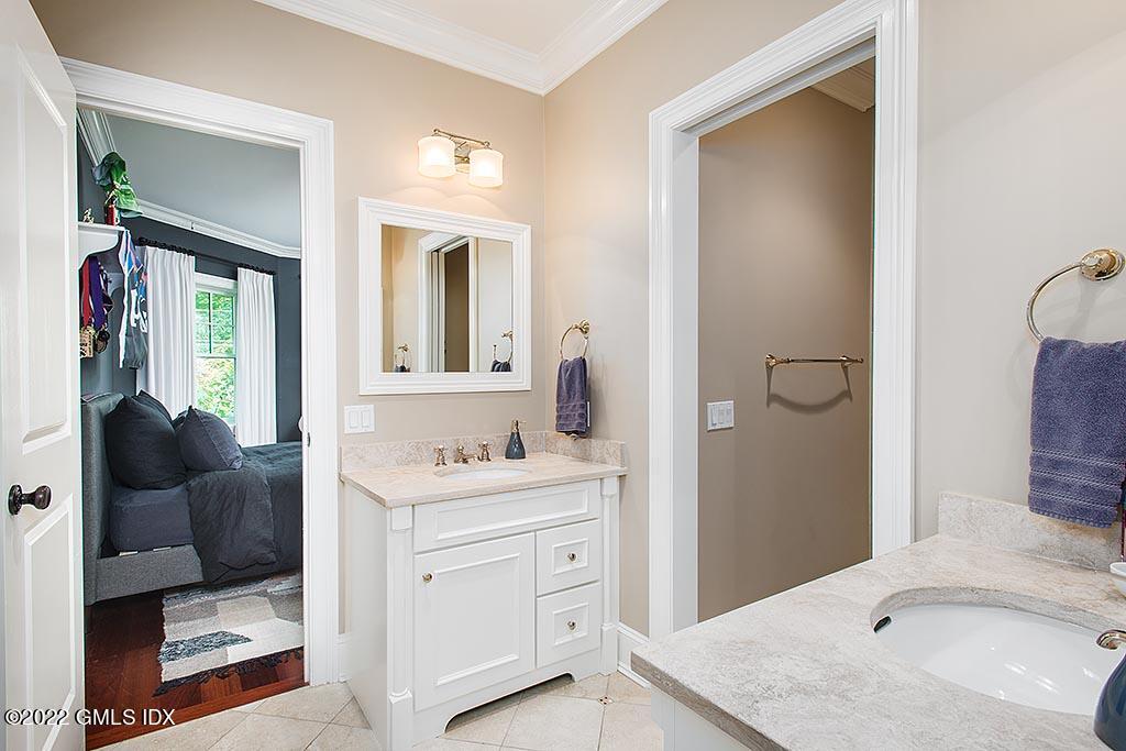 26 Hendrie Avenue Riverside, CT 06878 - Photo 19 of 37 a bathroom with a sink double vanity and a mirror