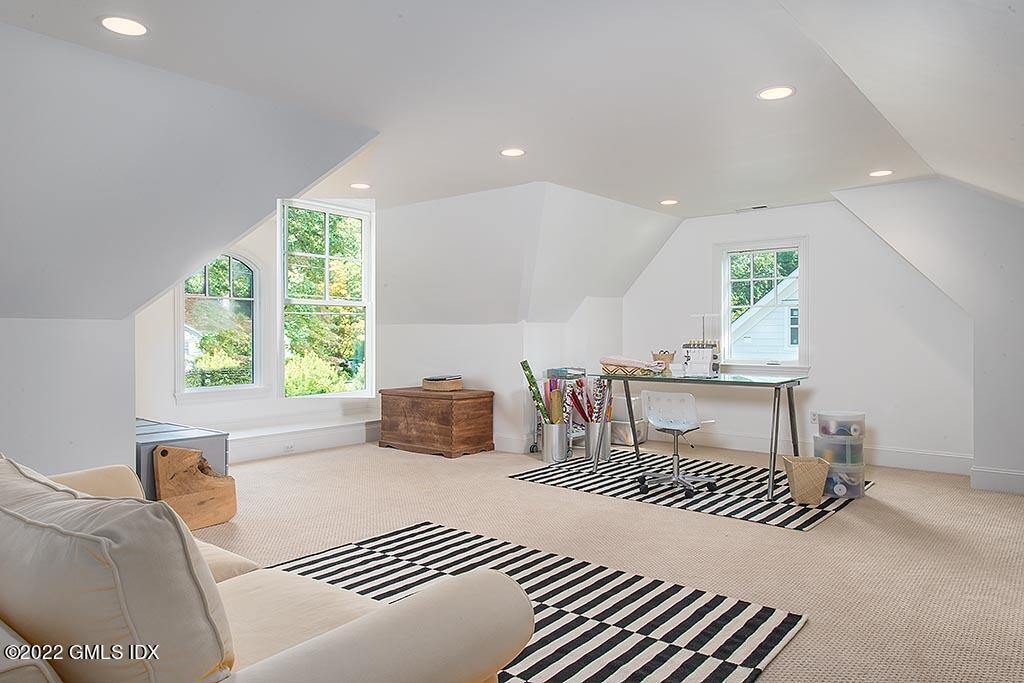 26 Hendrie Avenue Riverside, CT 06878 - Photo 20 of 37 a bedroom with furniture and a large window