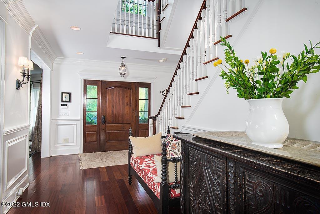 26 Hendrie Avenue Riverside, CT 06878 - Photo 2 of 37 a living room with wooden floor and potted plant