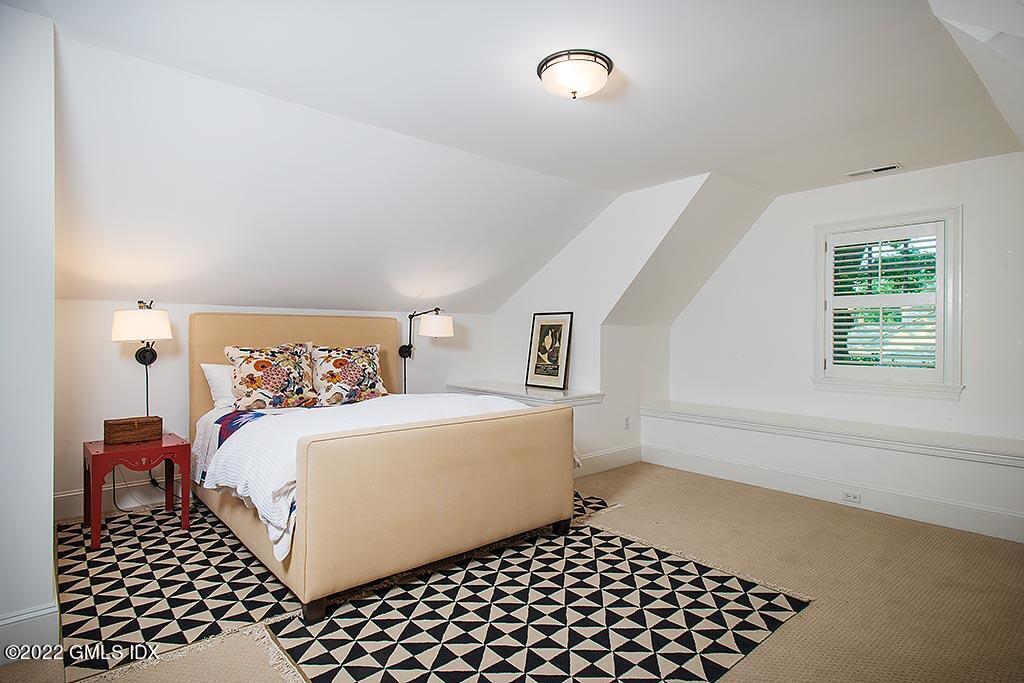 26 Hendrie Avenue Riverside, CT 06878 - Photo 21 of 37 a bedroom with a bed and a window