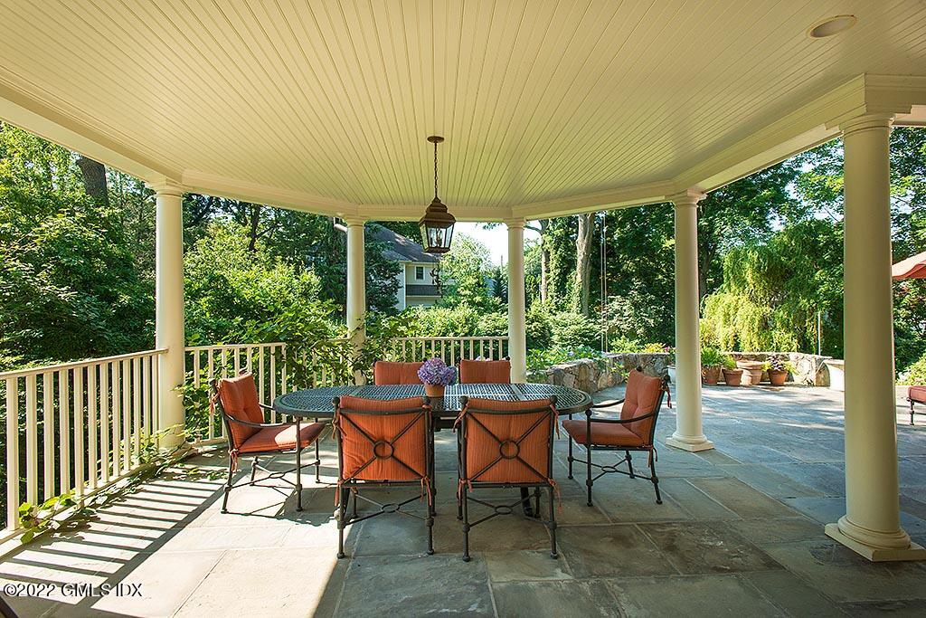 26 Hendrie Avenue Riverside, CT 06878 - Photo 25 of 37 a view of a dining room with furniture wooden floor and garden view