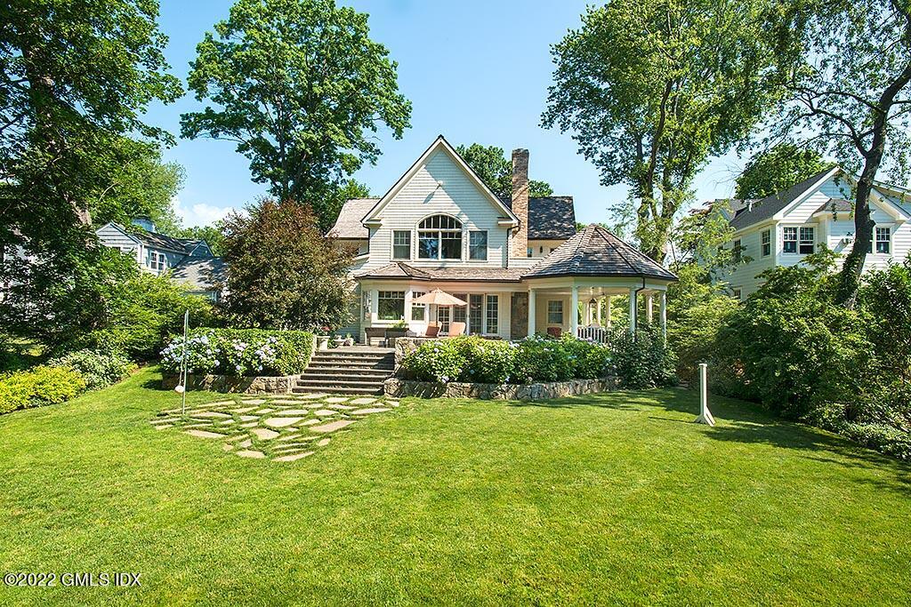 26 Hendrie Avenue Riverside, CT 06878 - Photo 29 of 37 a front view of a house with a yard