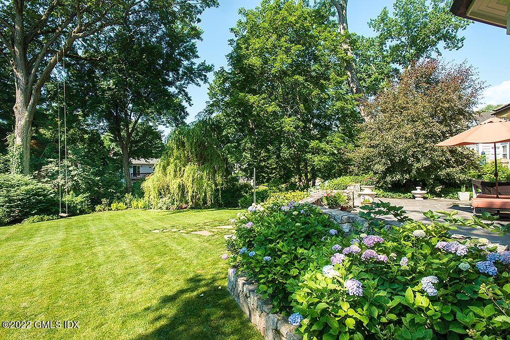 26 Hendrie Avenue Riverside, CT 06878 - Photo 32 of 37 a view of a big yard with plants and large trees