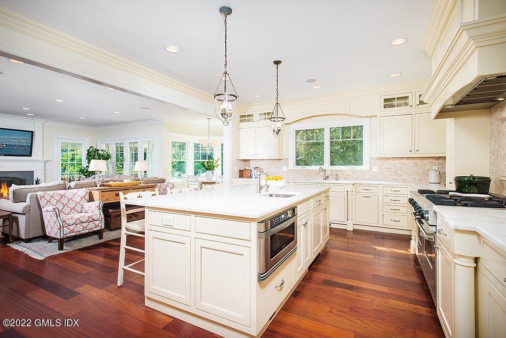 26 Hendrie Avenue Riverside, CT 06878 - Photo 8 of 37 a kitchen with a stove and a wooden floor