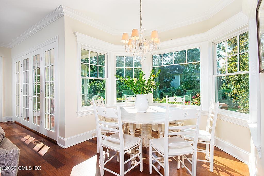 26 Hendrie Avenue Riverside, CT 06878 - Photo 9 of 37 a view of a dining room with furniture large windows and wooden floor