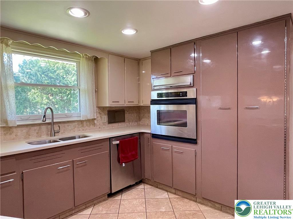 1331 Armstrong Road Bethlehem, PA 18017 - Photo 16 of 47 a kitchen with stainless steel appliances granite countertop a sink and cabinets