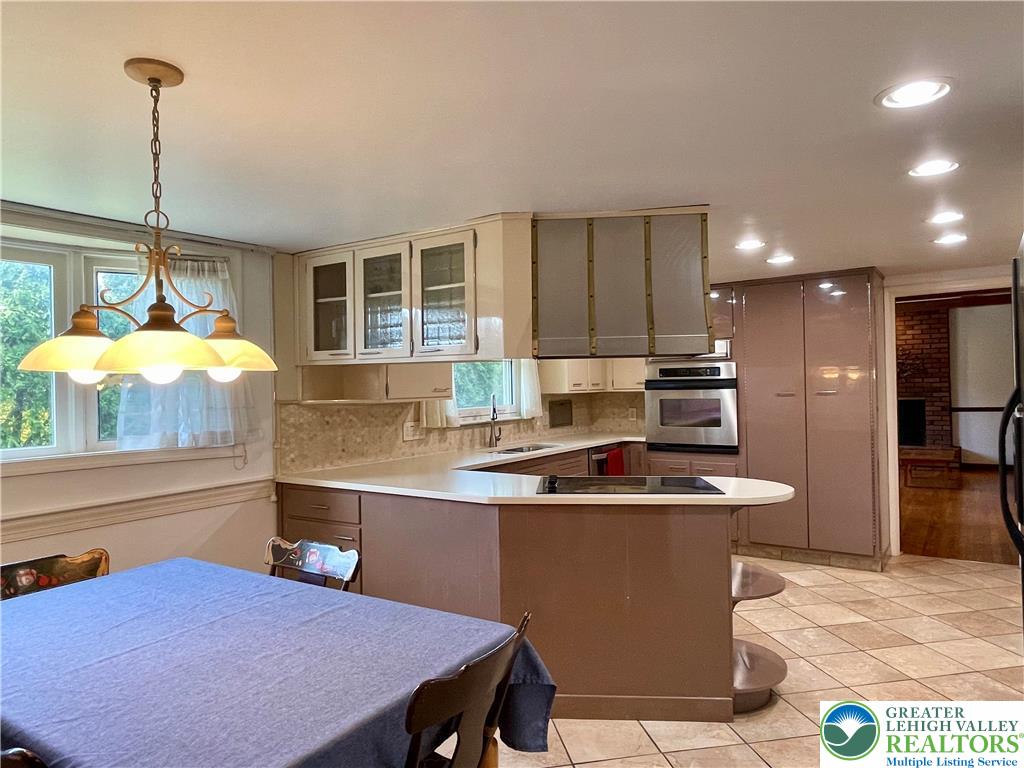 1331 Armstrong Road Bethlehem, PA 18017 - Photo 18 of 47 a kitchen with stainless steel appliances granite countertop a sink a stove and a wooden floors