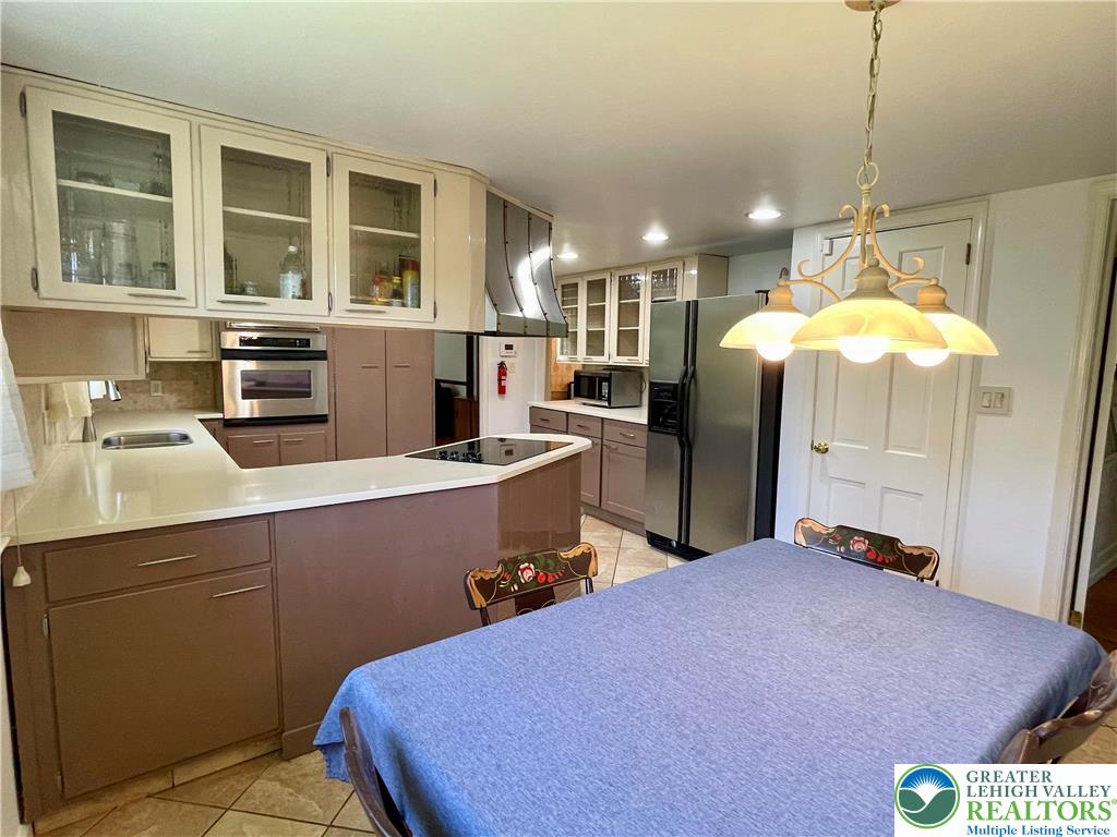 1331 Armstrong Road Bethlehem, PA 18017 - Photo 20 of 47 a kitchen with a sink appliances and cabinets