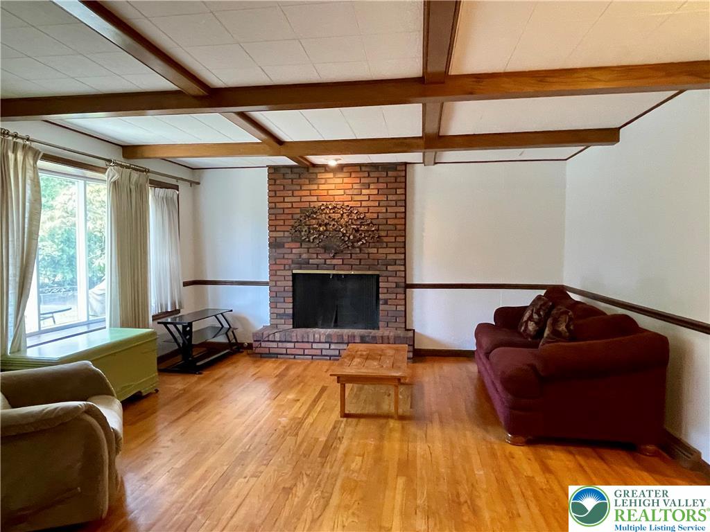 1331 Armstrong Road Bethlehem, PA 18017 - Photo 23 of 47 a living room with furniture rug and a fireplace
