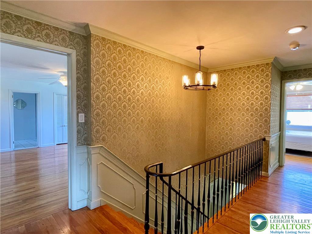 1331 Armstrong Road Bethlehem, PA 18017 - Photo 32 of 47 a view of a hallway with wooden floor and staircase