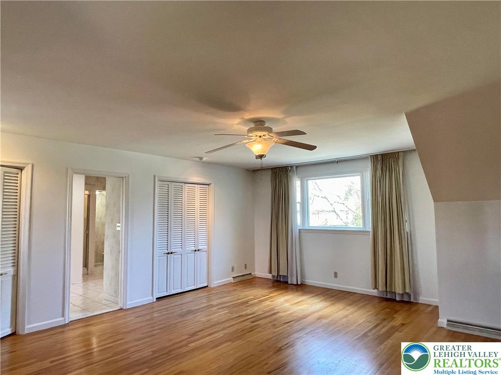 1331 Armstrong Road Bethlehem, PA 18017 - Photo 34 of 47 an empty room with wooden floor closet and windows
