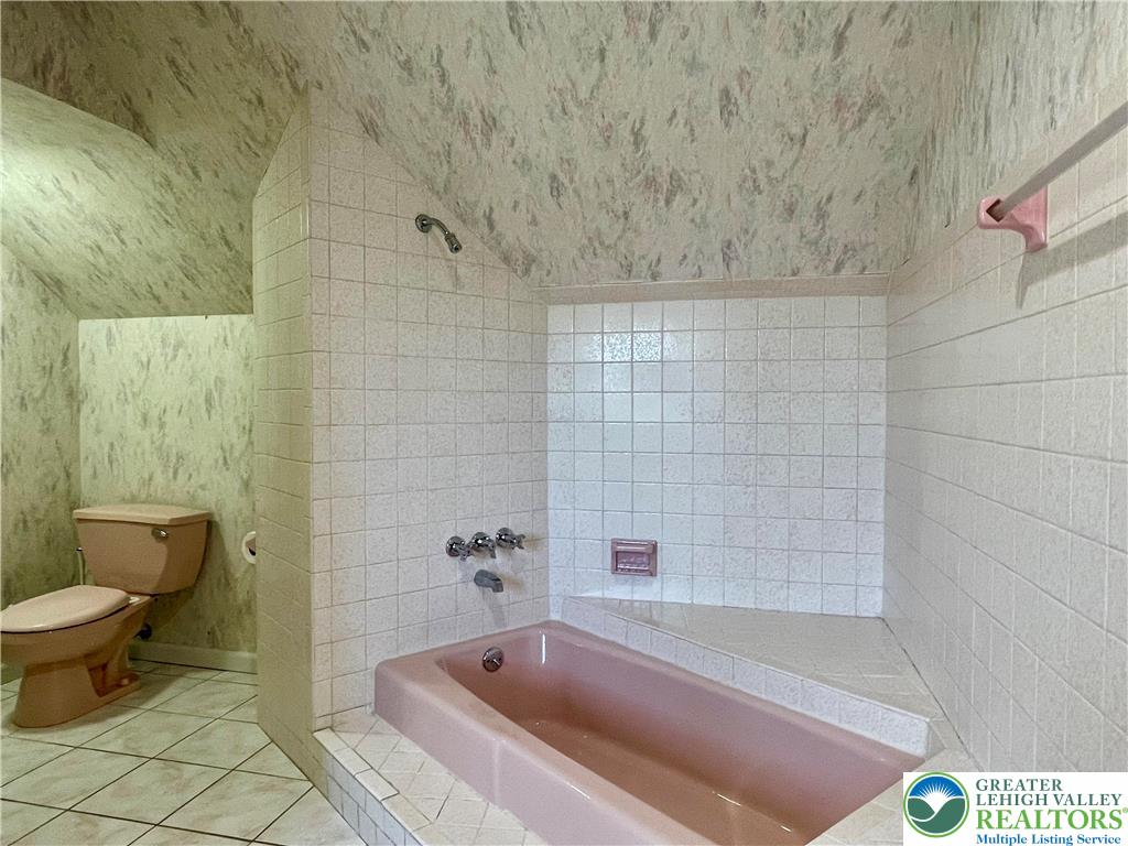 1331 Armstrong Road Bethlehem, PA 18017 - Photo 37 of 47 a bath tub sitting next to a white toilet and sink