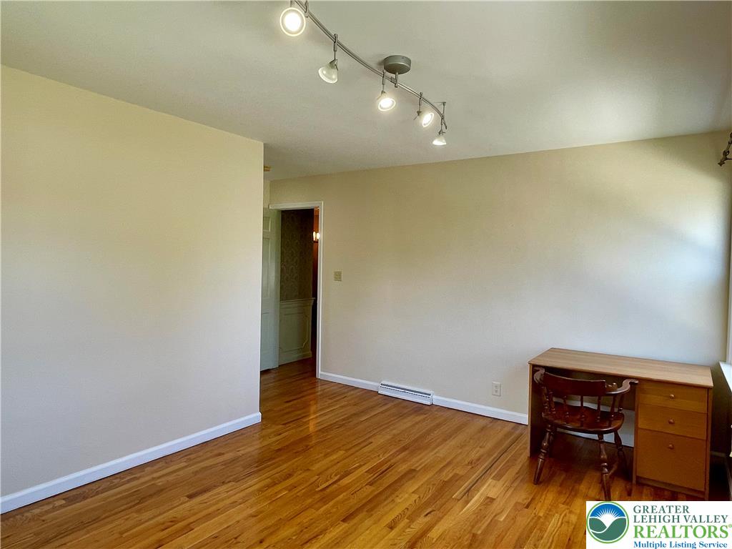 1331 Armstrong Road Bethlehem, PA 18017 - Photo 39 of 47 an empty room with wooden floor and furniture