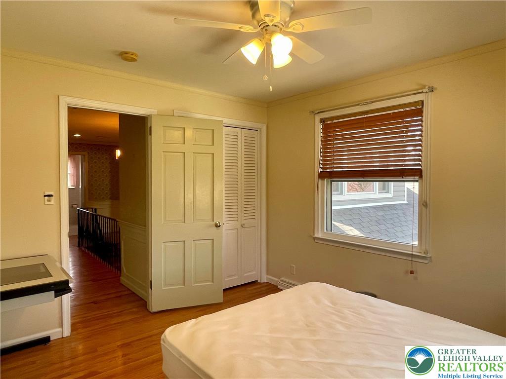 1331 Armstrong Road Bethlehem, PA 18017 - Photo 41 of 47 a bedroom with a bed and a chandelier