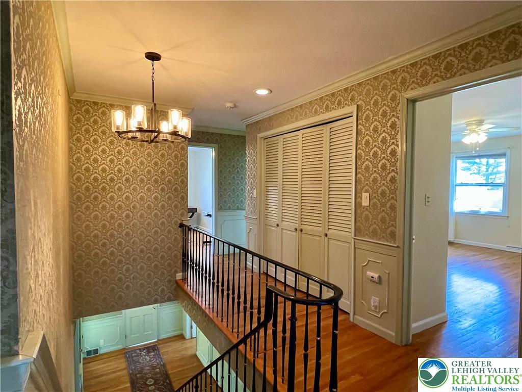 1331 Armstrong Road Bethlehem, PA 18017 - Photo 42 of 47 a view of a hallway with wooden floor and staircase