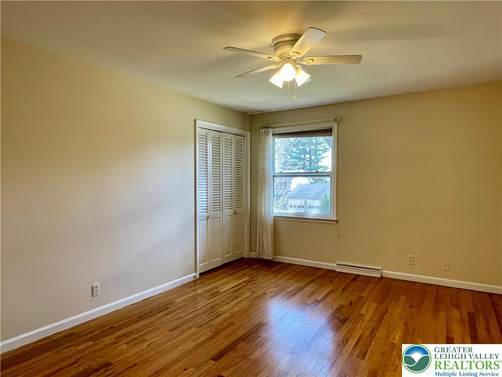 1331 Armstrong Road Bethlehem, PA 18017 - Photo 43 of 47 an empty room with wooden floor and windows