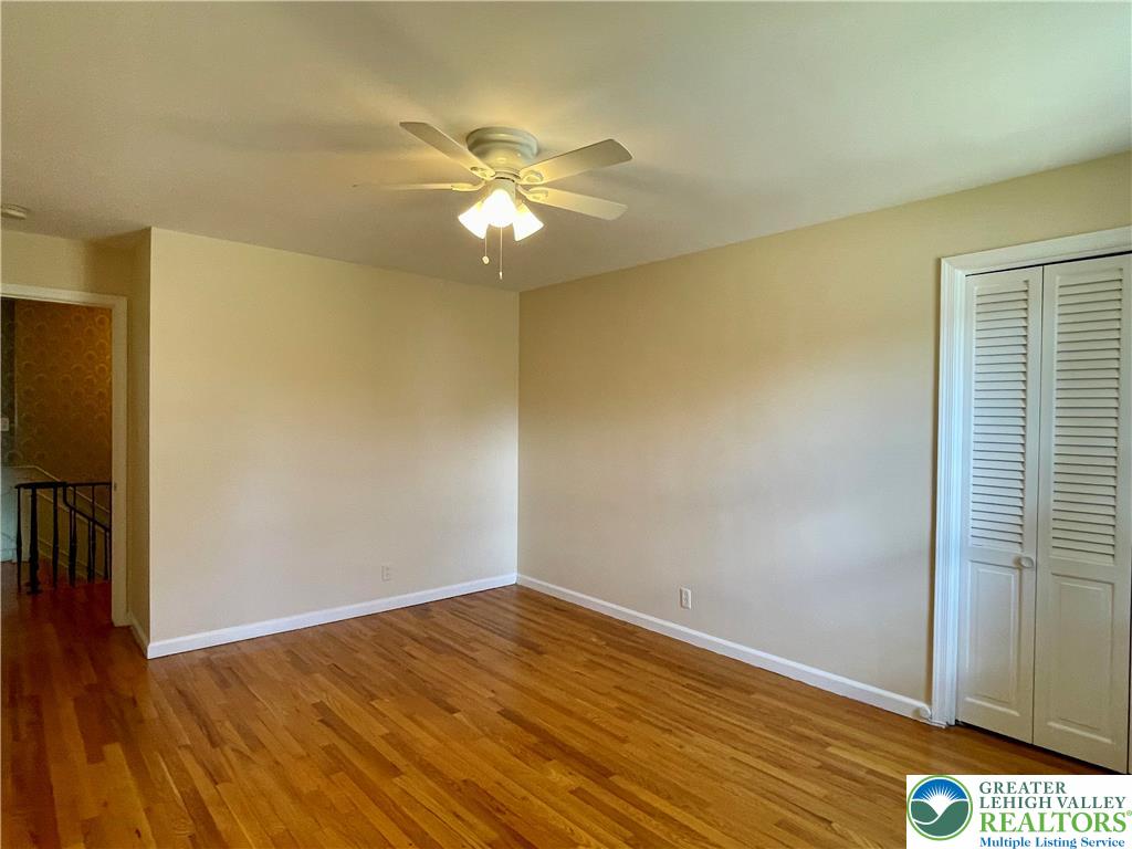 1331 Armstrong Road Bethlehem, PA 18017 - Photo 44 of 47 a view of empty room with wooden floor and fan