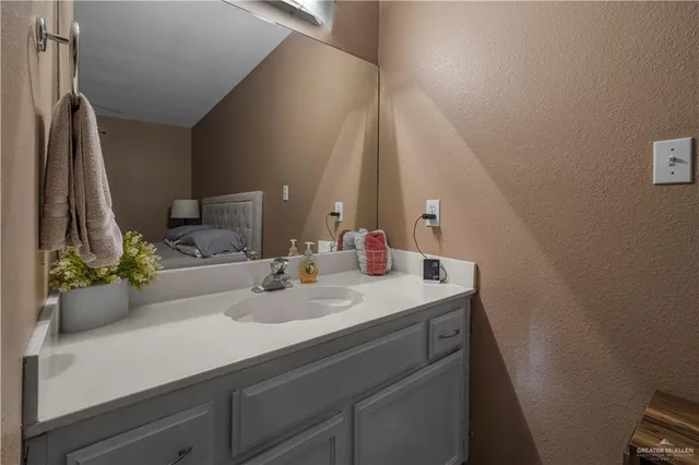 a bathroom with a sink and a mirror