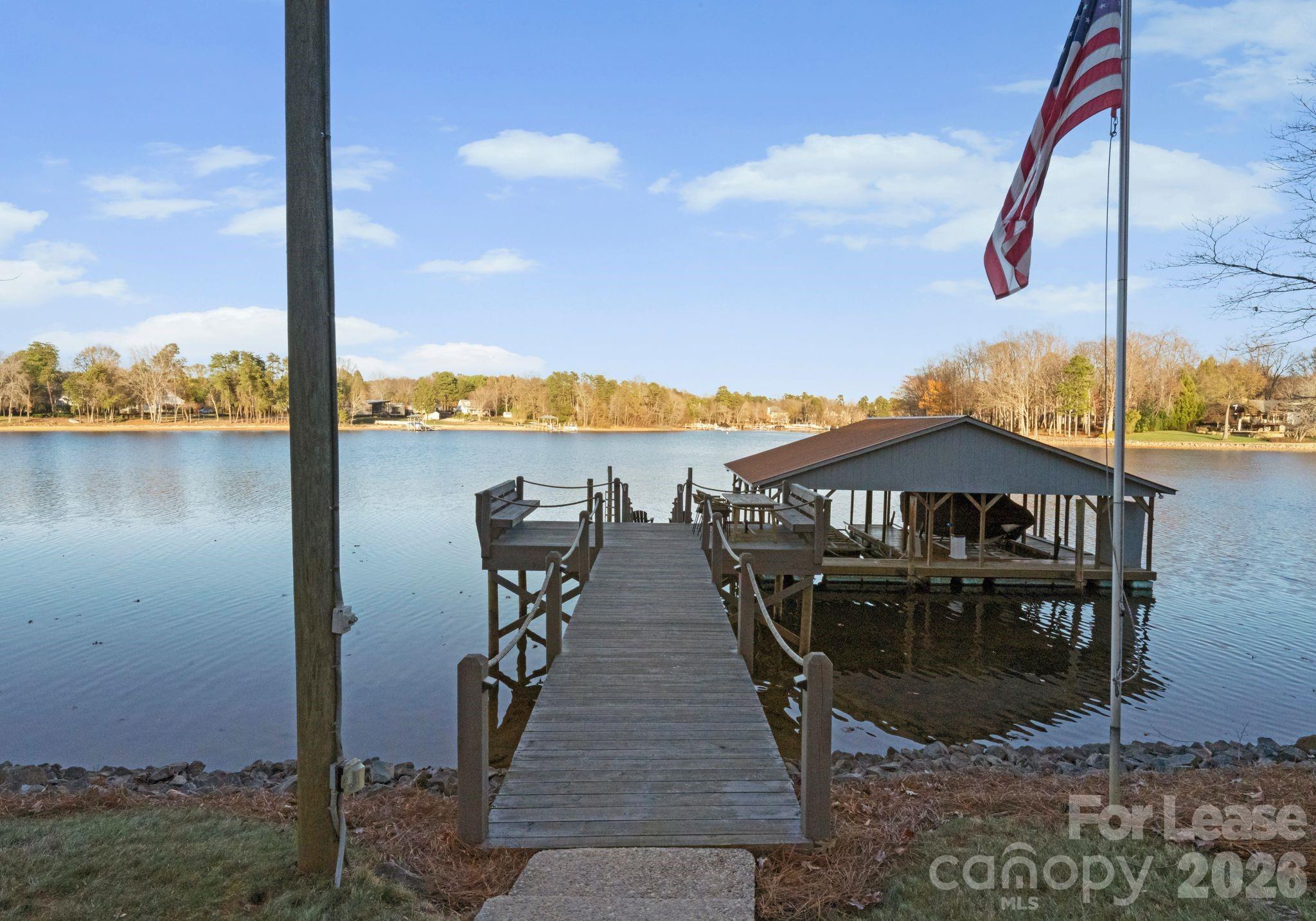 19709 Stough Farm Road Cornelius, NC 28031 - Photo 38 of 48 a view of a lake with a sitting space