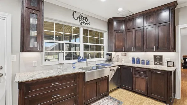 a kitchen with a sink and cabinets