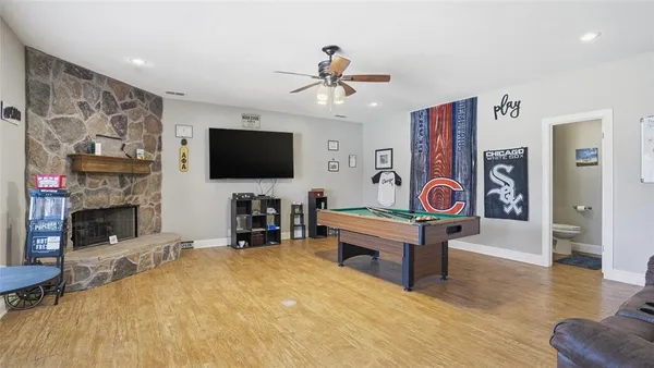 a living room with fireplace furniture and a flat screen tv
