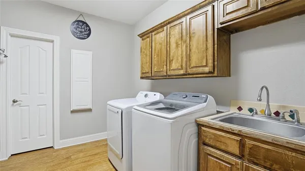 a bathroom with a sink and a window