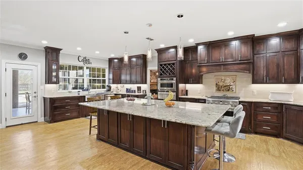 a kitchen with a sink stove and cabinets