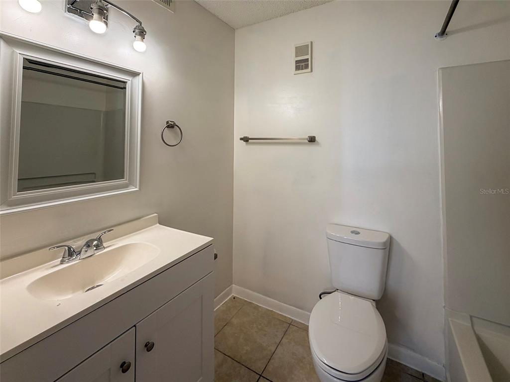 3921 Southwest 34th Street, Unit 301 Gainesville, FL 32608 - Photo 14 of 31 a white toilet sitting next to a bathroom sink