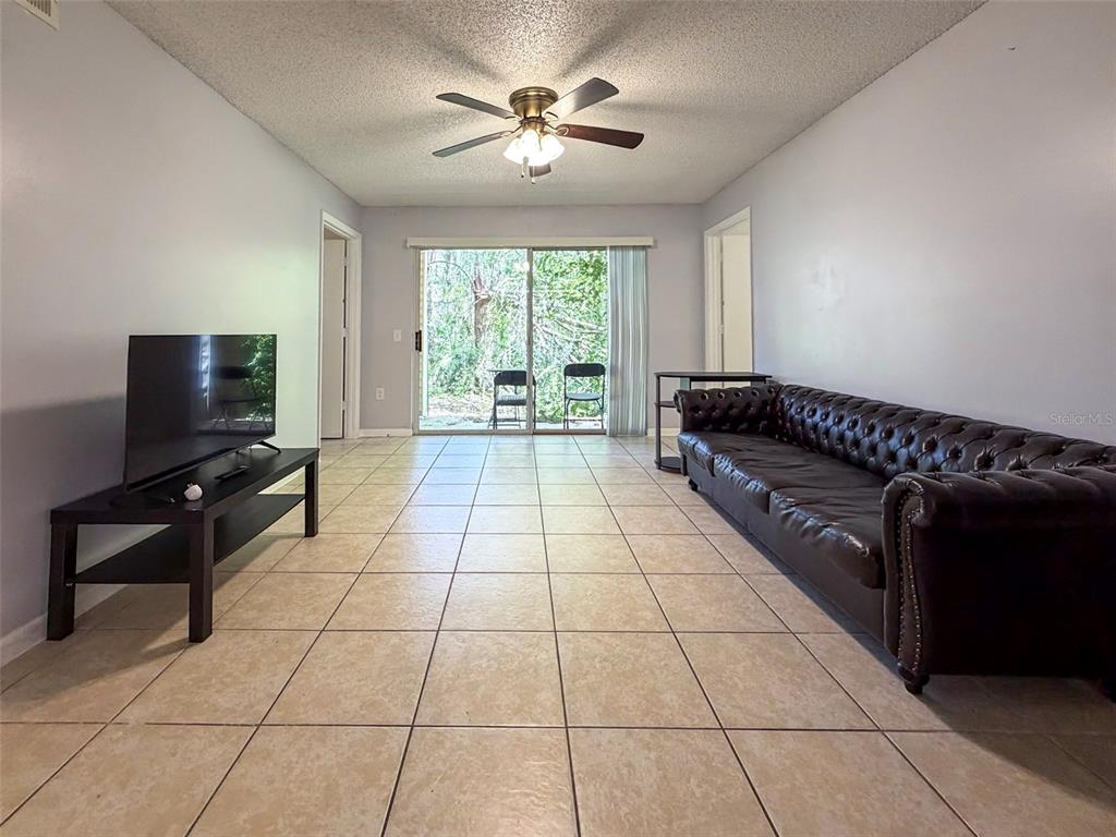3921 Southwest 34th Street, Unit 301 Gainesville, FL 32608 - Photo 16 of 31 a picture of a livingroom with furniture
