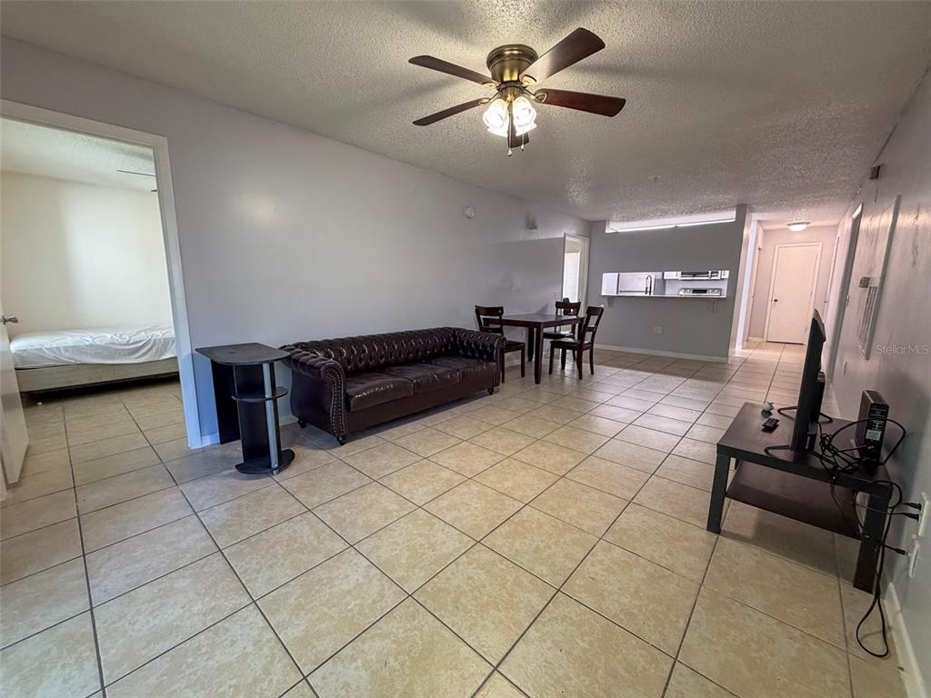 3921 Southwest 34th Street, Unit 301 Gainesville, FL 32608 - Photo 22 of 31 a view of a livingroom with furniture and a chandelier