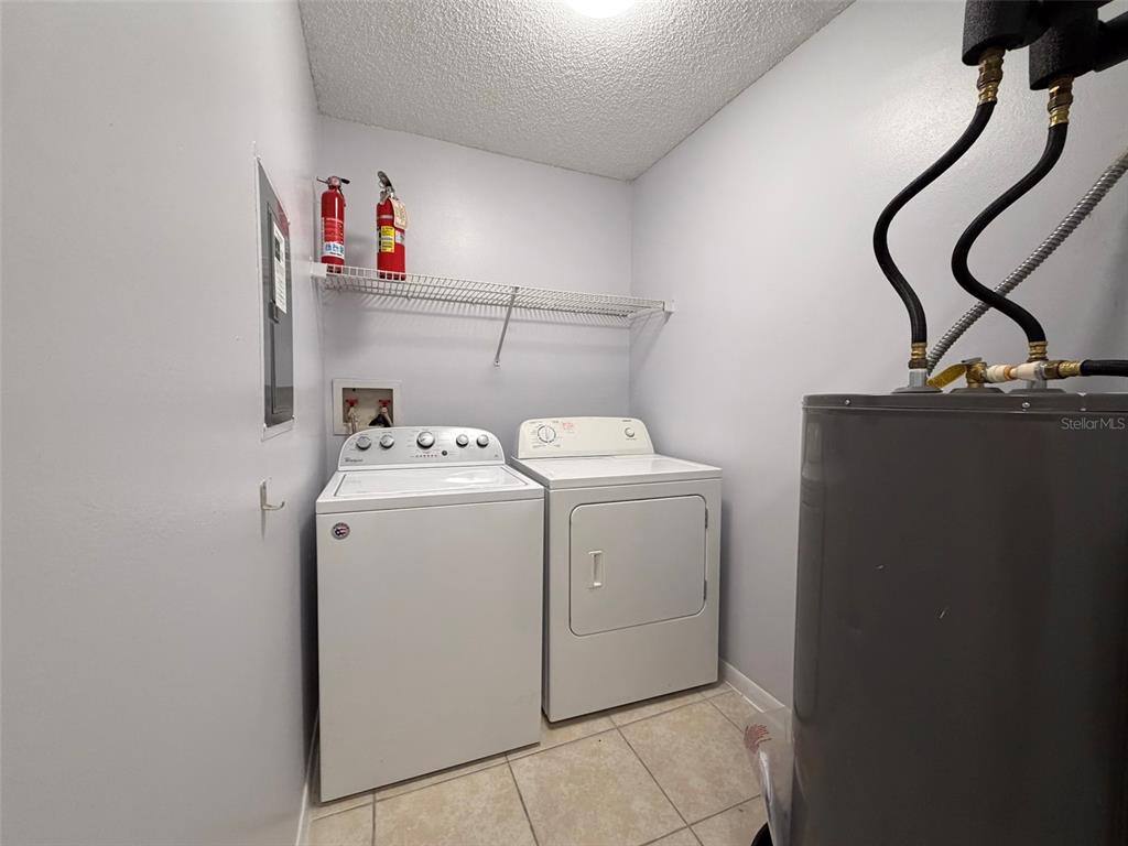 3921 Southwest 34th Street, Unit 301 Gainesville, FL 32608 - Photo 28 of 31 a utility room with dryer and washer