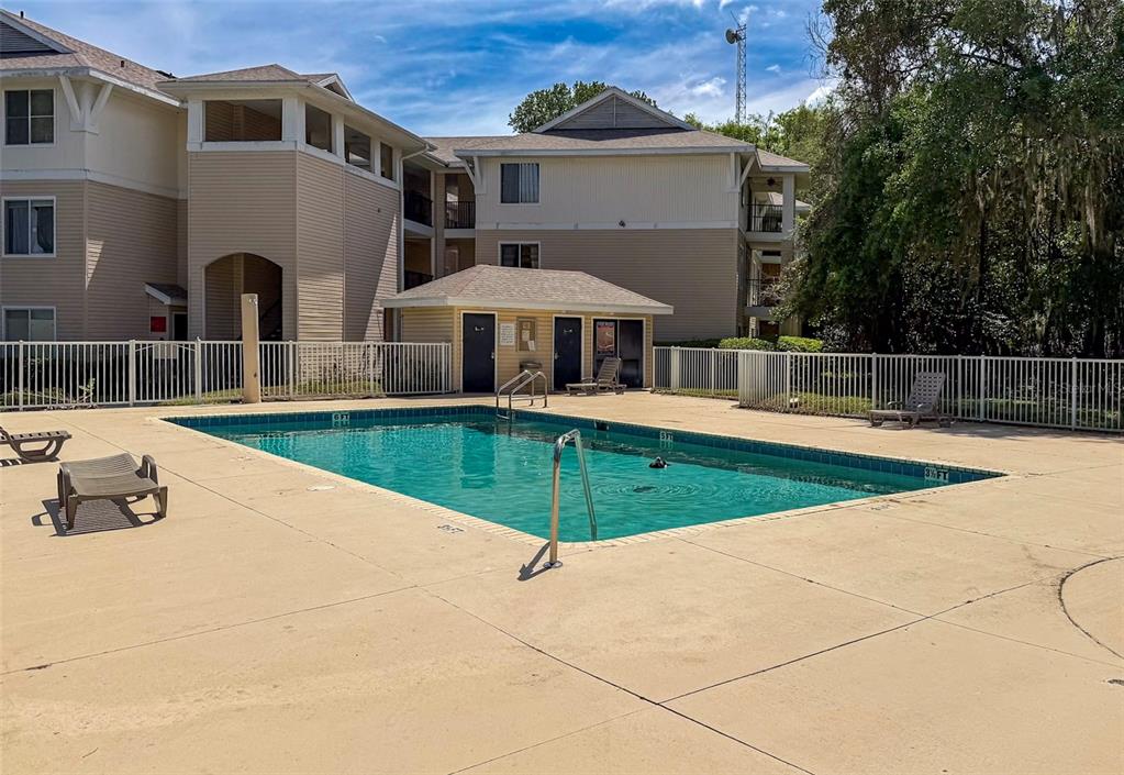 3921 Southwest 34th Street, Unit 301 Gainesville, FL 32608 - Photo 29 of 31 a view of a backyard with swimming pool