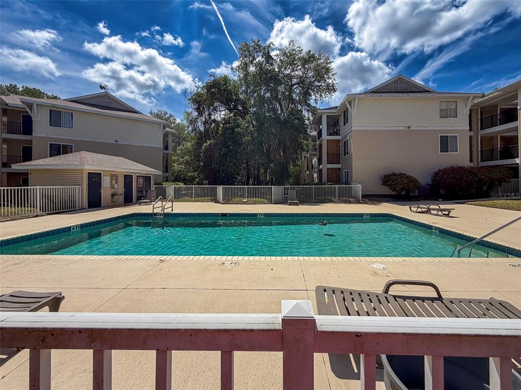 3921 Southwest 34th Street, Unit 301 Gainesville, FL 32608 - Photo 30 of 31 a view of a house with a yard
