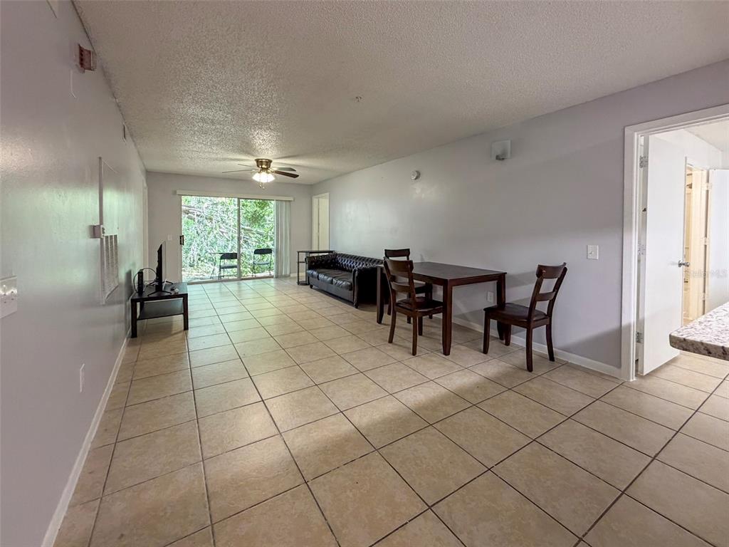 3921 Southwest 34th Street, Unit 301 Gainesville, FL 32608 - Photo 6 of 31 a view of a dining room with furniture