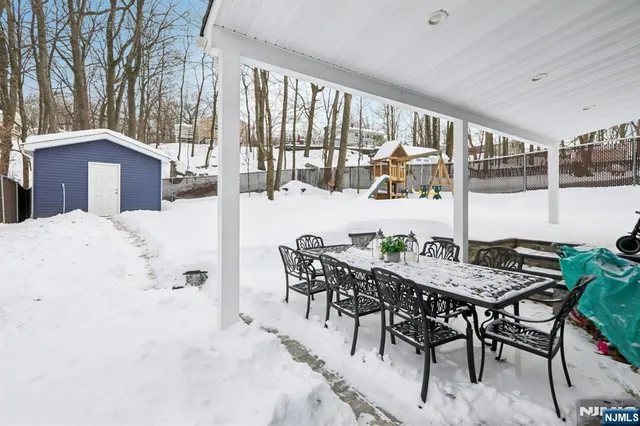 a view of a dining room with furniture and window